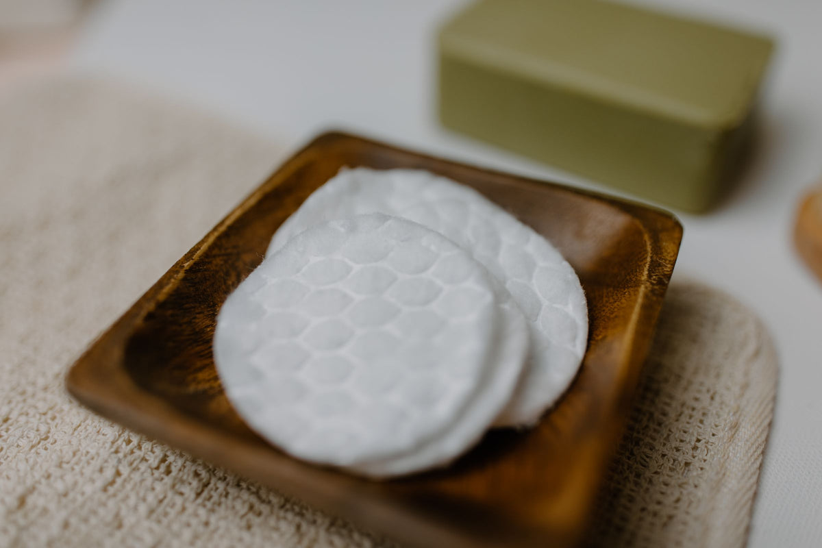 Cotton pads on a wooden tray