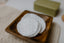 Cotton pads on a wooden tray