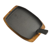 BSTRD. cast iron serving plate on wooden base